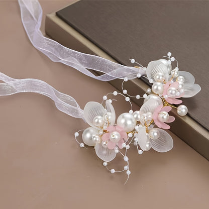 Romantic bridal headpiece with faux pearls, floral wreath, and ribbon tie.