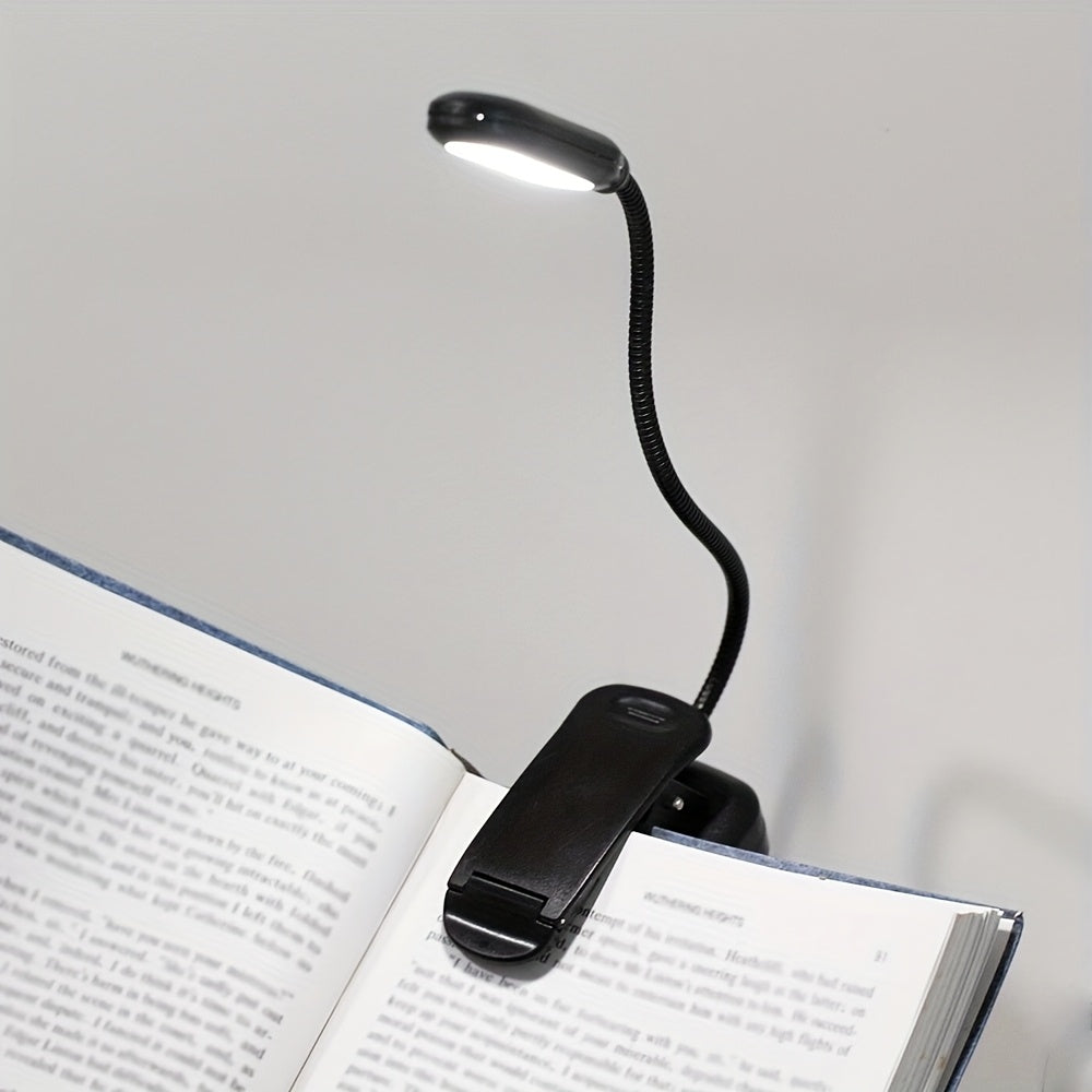 Portable battery-powered clip-on book light for reading that can also be used as a small table lamp or night light for room decor.