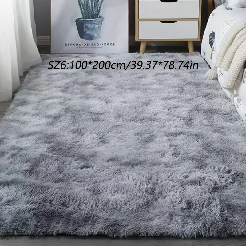 A stylish light grey tie-dye gradient plush carpet perfect for your living room, coffee table, or bedside. This long-haired washable mat is ideal for adding a touch of Nordic style to your bedroom.