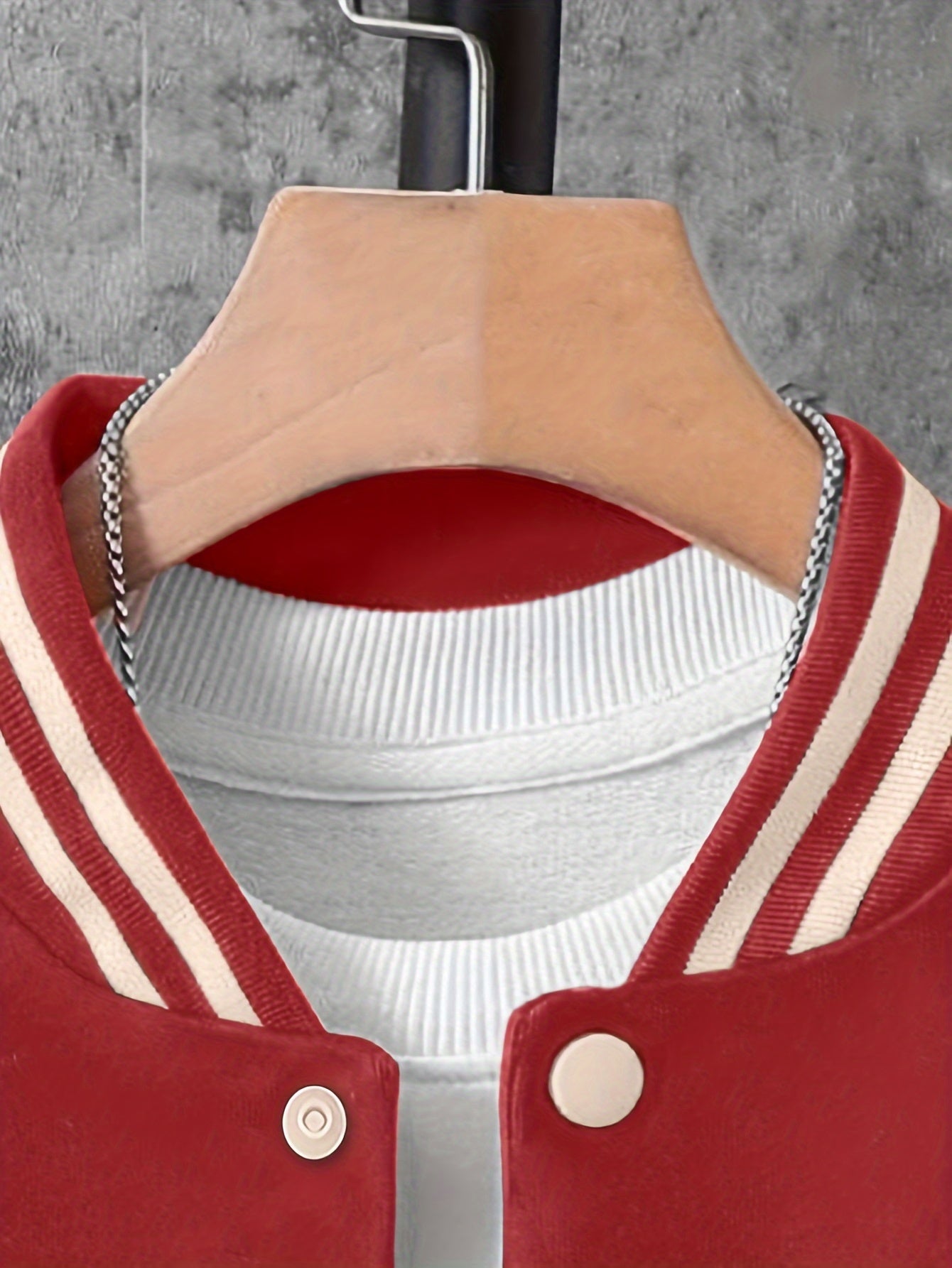 Boys' polyester varsity jacket with geometric pattern and baseball collar, featuring letter A and number 23 print.