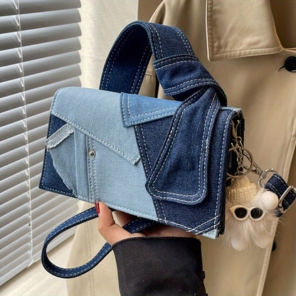 Stylish, denim-inspired crossbody bag for women. Magnetic closure, machine washable. Available in Royal Blue/Black.