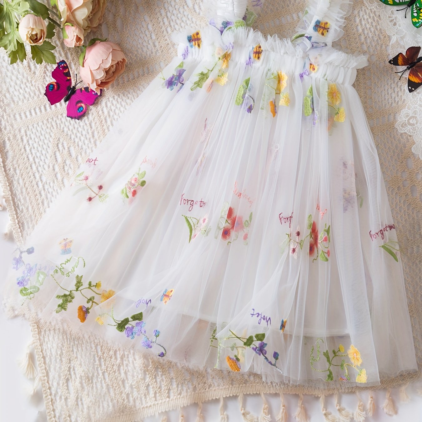 Baby's sleeveless mesh dress with elegant flower embroidery, perfect for summer birthday parties or as a gift.