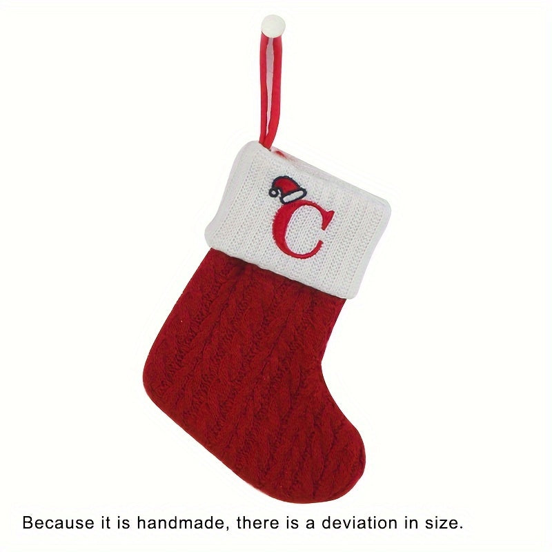 11" Christmas stocking with knitted alphabet design, perfect for hanging on the Xmas tree or using as a gift bag. Made of polyester.