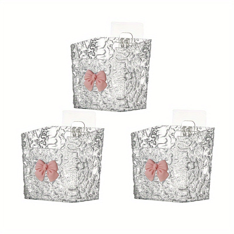 Set of 1/2/3 Acrylic Hanging Storage Bins with Embossed Pattern for Bathroom & Kitchen. Perfect for organizing toothbrushes, toothpaste, makeup, and can be wall-mounted or used on tabletops. Made of plastic.