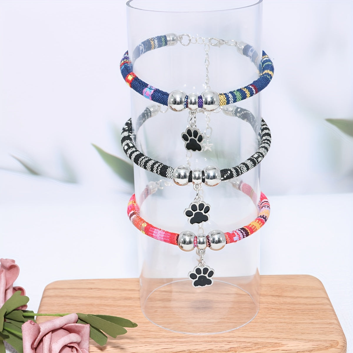 Durable, stylish, adjustable nylon pet necklace with colorful paw print pendant. Suitable for cats and small dogs.