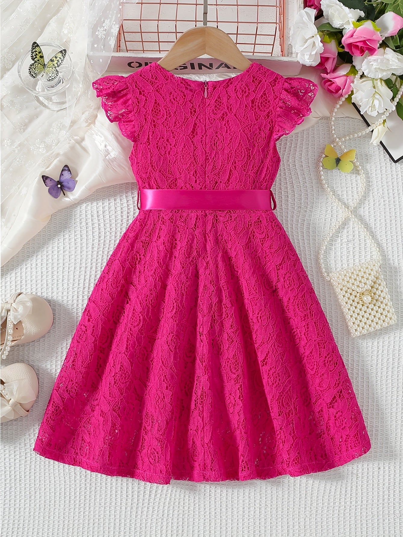 Girls' spring/summer dress with lace detail, belt, and flutter sleeves, ideal for daily wear or birthday parties.