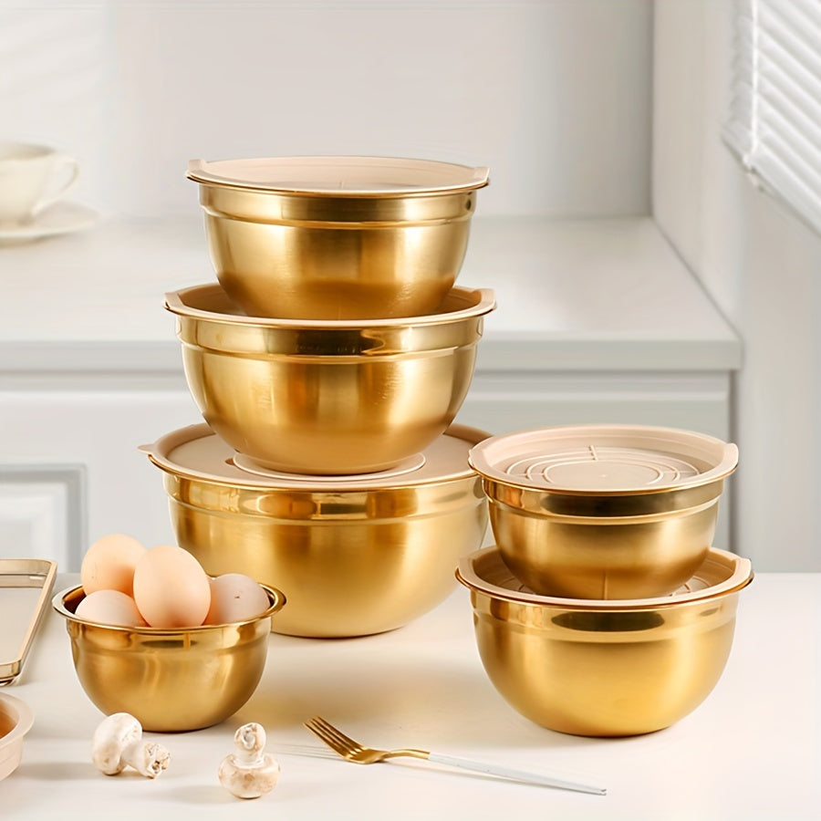 Stainless steel mixing bowl set in gold with lids in white, black, and khaki. Ideal for Christmas serving, baking, preparation, cooking, and serving food. Nested design saves space, dishwasher safe. Available in various sizes from 500ml to 4000ml.