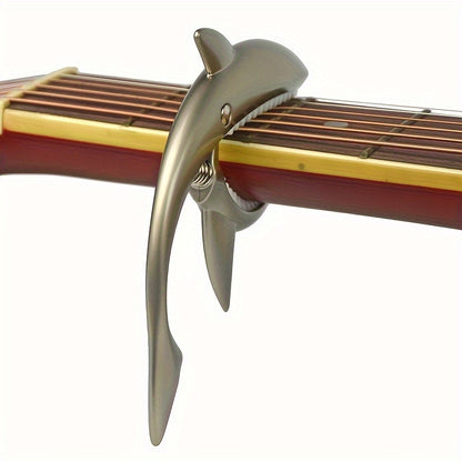 Stylish zinc alloy capo for acoustic and electric guitars, changes pitch.