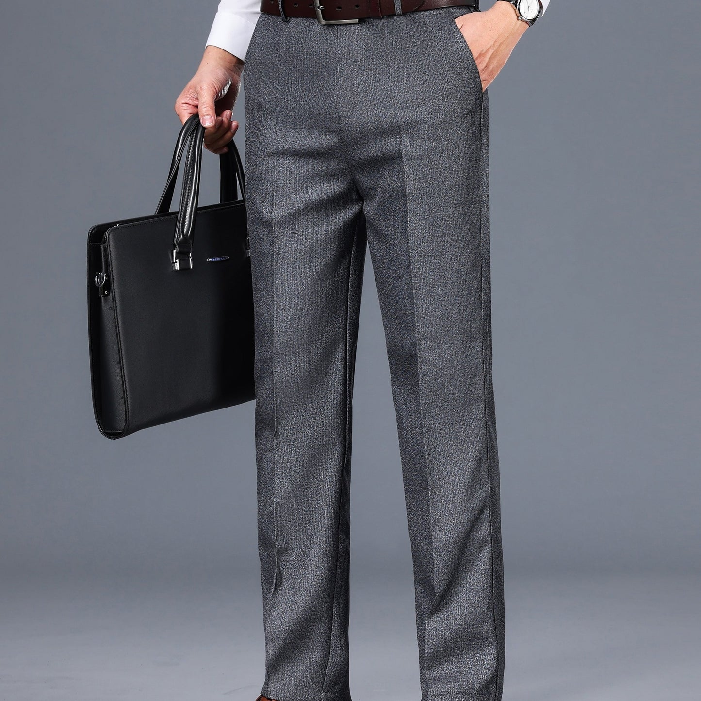 Gray dress pants for men with a straight fit, medium thickness, slant pockets, zip closure, and non-stretch polyester fabric. Suitable for business casual or formal wear in spring and