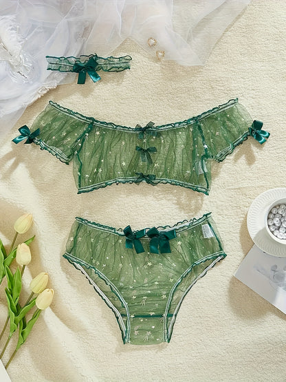 Stylish sheer lingerie set with bow detail - includes bra, panty, and garter belt - made from breathable polyester blend - ideal for romantic occasions.