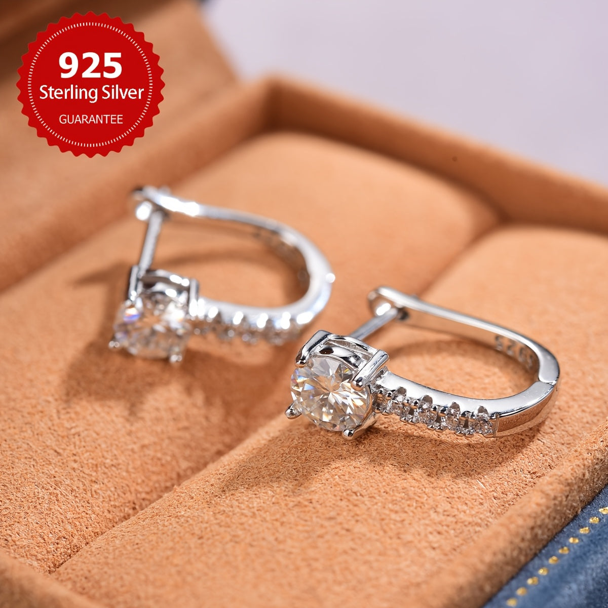 These elegant U-shaped earrings feature 1CT shiny moissanite stones set in 925 sterling silver. They make a perfect Valentine's Day gift and are ideal for weddings. With a luxurious and noble design, these earrings weigh approximately 2.4 grams and each