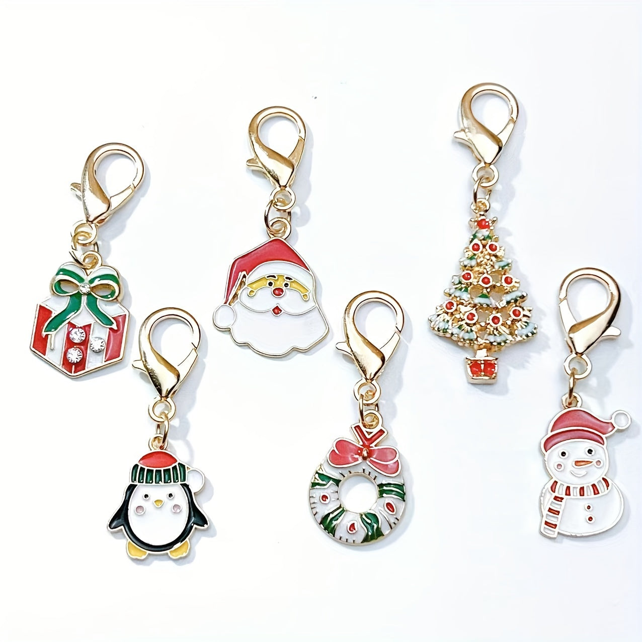 Six Christmas keychain charms made of zinc alloy with festive keyrings. These non-plated metal bag pendants are simple in style and perfect as holiday gifts for friends.