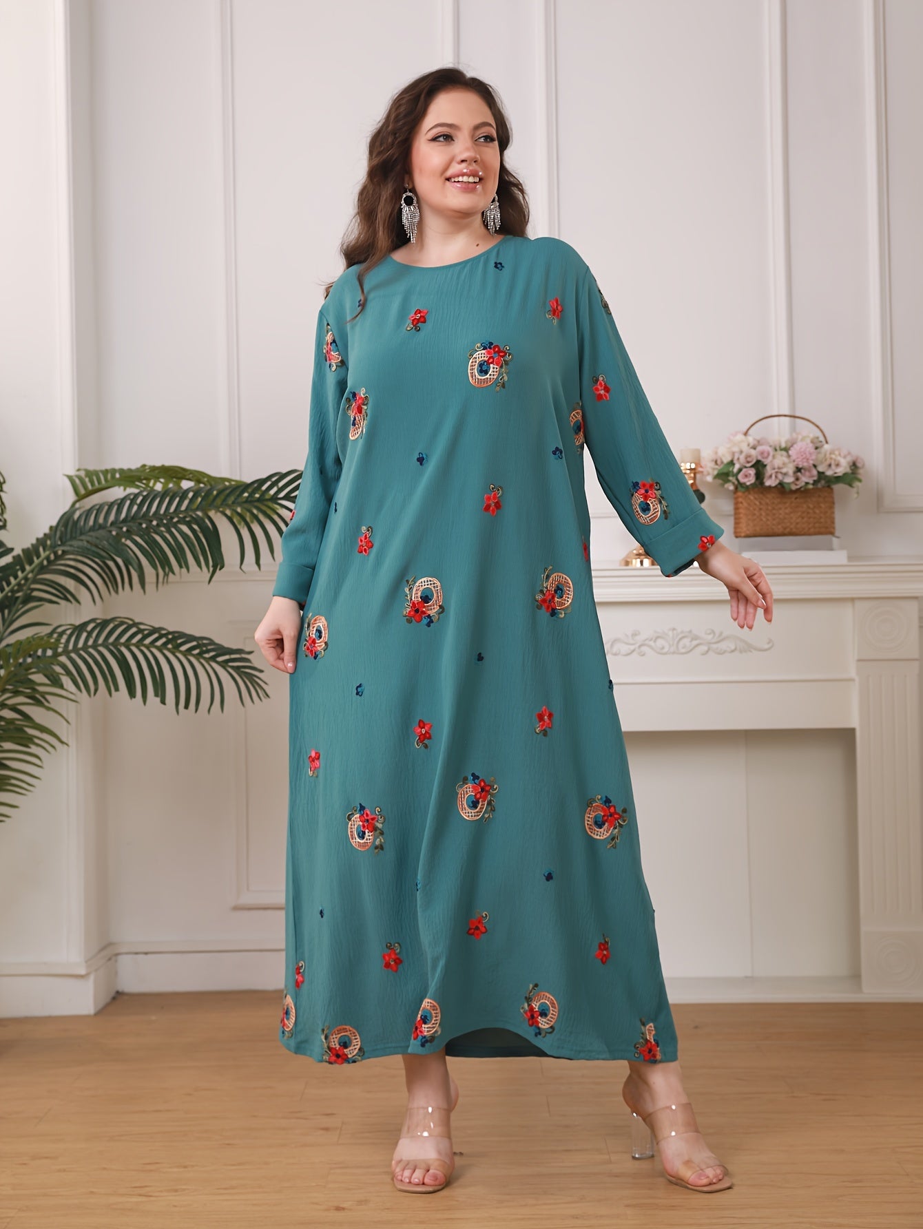 Elegant floral print women's plus size abaya with long sleeves and loose fit in traditional Middle Eastern style.