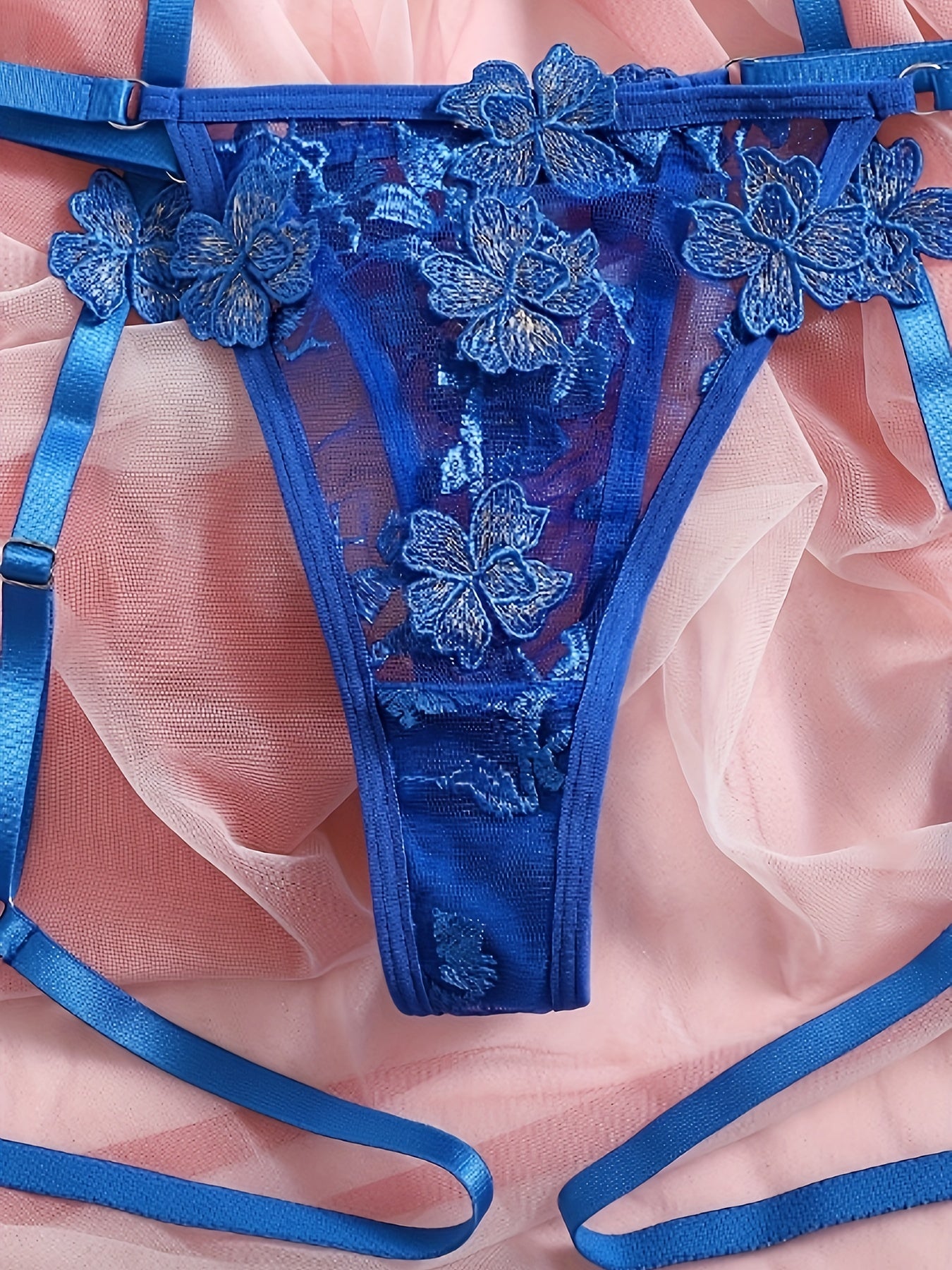 Floral embroidered mesh lingerie set with underwire, hollow-out bra, thong, and garter belts. Sexy and semi-sheer for women.