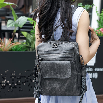 Retro brown women's fashion backpack with large capacity and versatile design, including multiple zippers. Can also be used as a crossbody or shoulder bag.