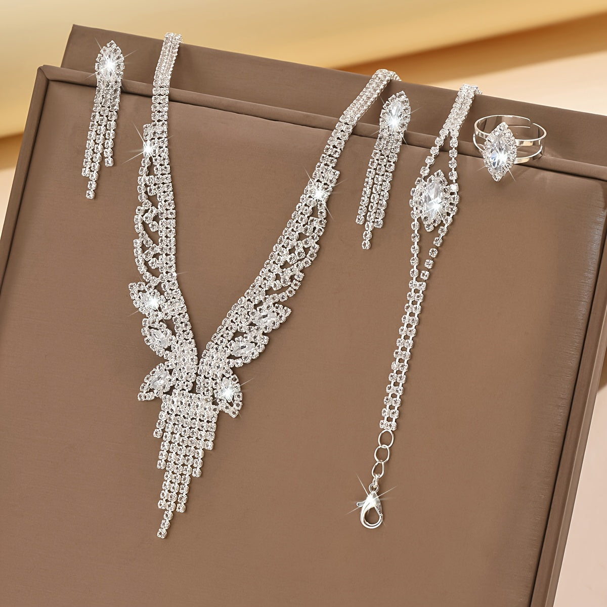 Sophisticated Bridal Jewelry Set made of Silver Plated Copper and Synthetic Zirconia includes a Necklace, Bracelet, and Earrings. Perfect for weddings, banquets, parties, and as a stylish accessory for Thanksgiving Day.