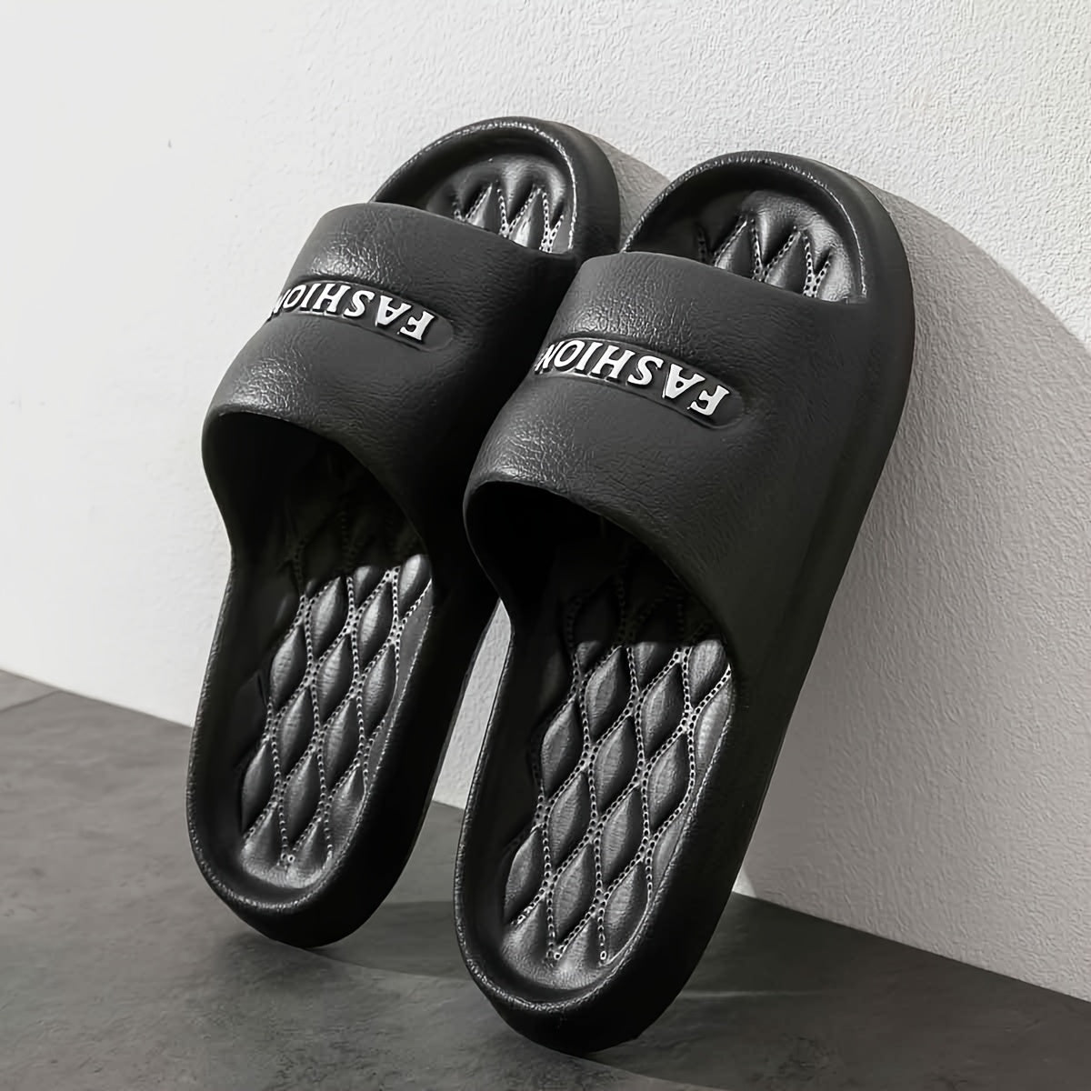 Stylish black EVA slides with thick, non-slip, odor-resistant sole for indoor/outdoor wear.