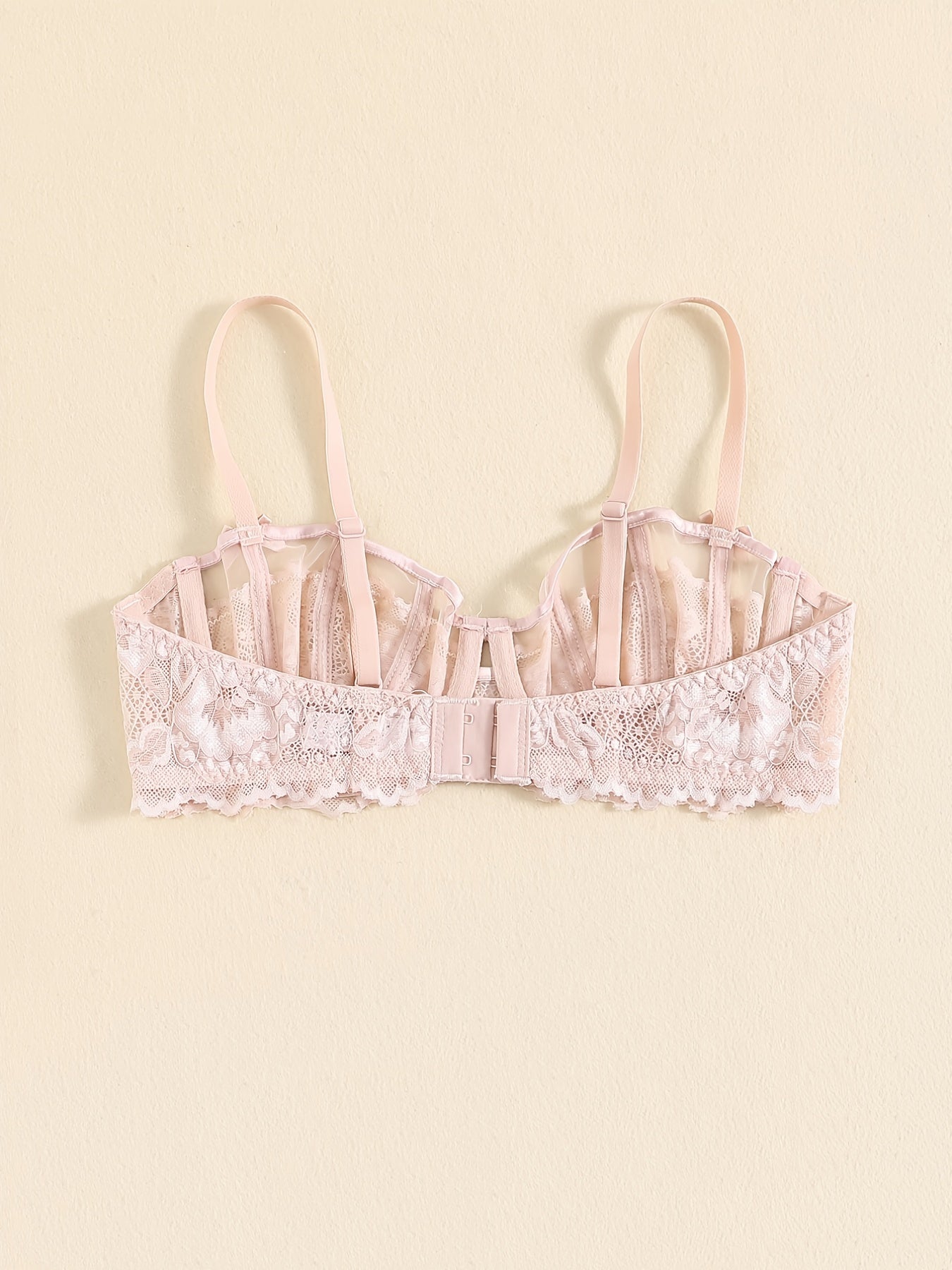 Floral lace unlined bra and bow panties set for women.