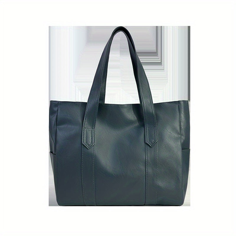 Chic black tote bag for women with foldable design, zip closure, multiple compartments, and polyester lining.