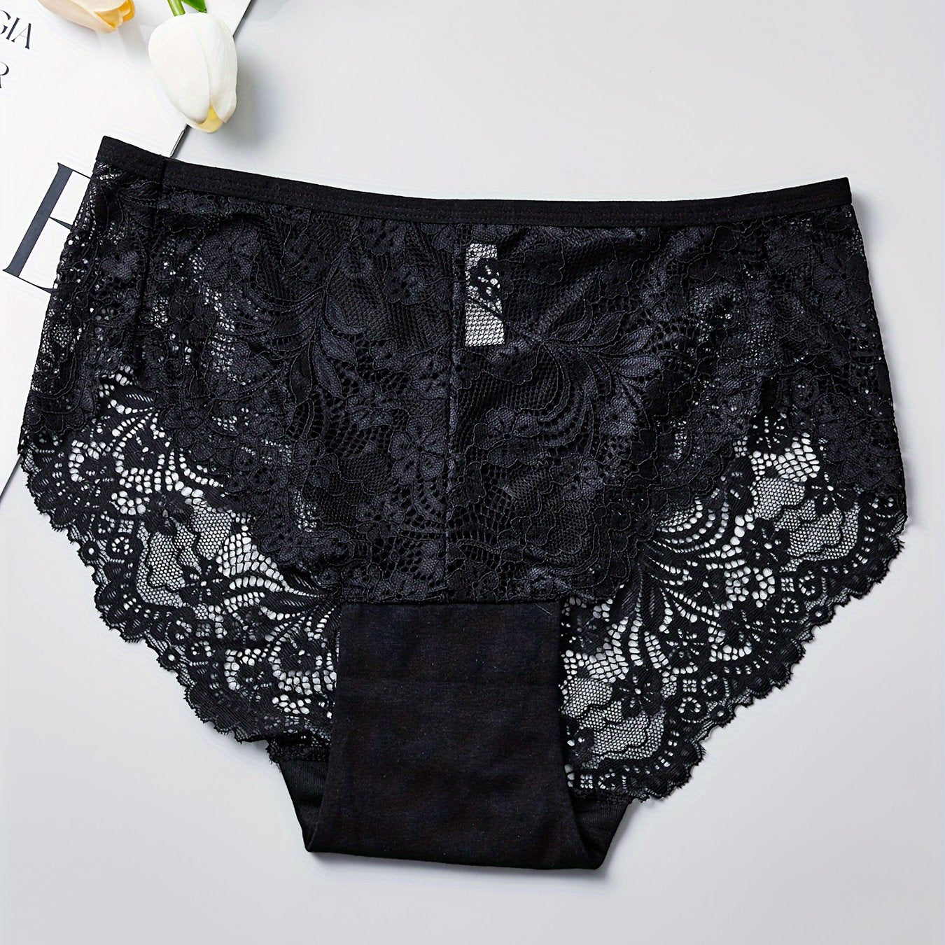 1 pair of women's lace-trimmed brief panties made from soft, breathable nylon blend for everyday wear, sleep, dates, and light sports. Cute and semi-transparent design.