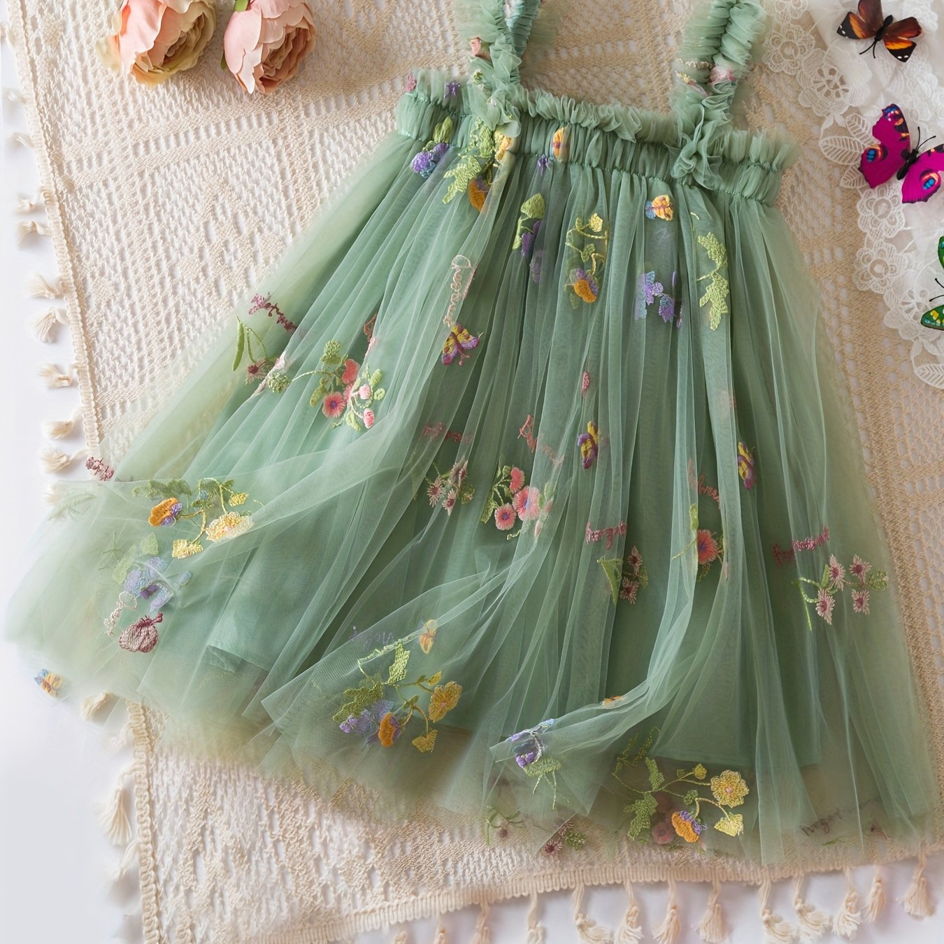 Baby's sleeveless mesh dress with elegant flower embroidery, perfect for summer birthday parties or as a gift.