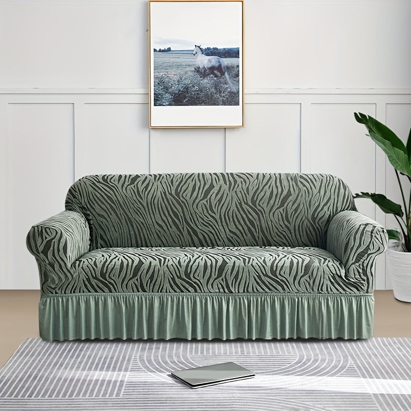 Wave pattern sofa slipcover with skirt, non-slip and dustproof. Protects furniture from cat scratches. Machine washable for easy cleaning. Suitable for bedroom, office, or living room décor.