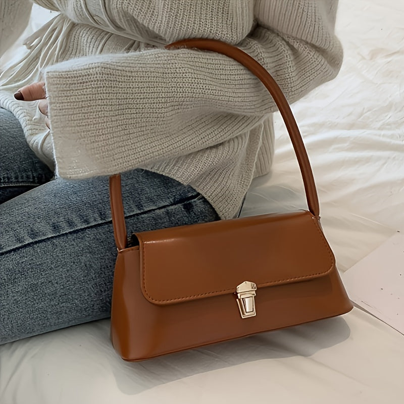 Vintage underarm handbag made of faux leather with fixed strap, buckle closure, and polyester lining - Do not wash.