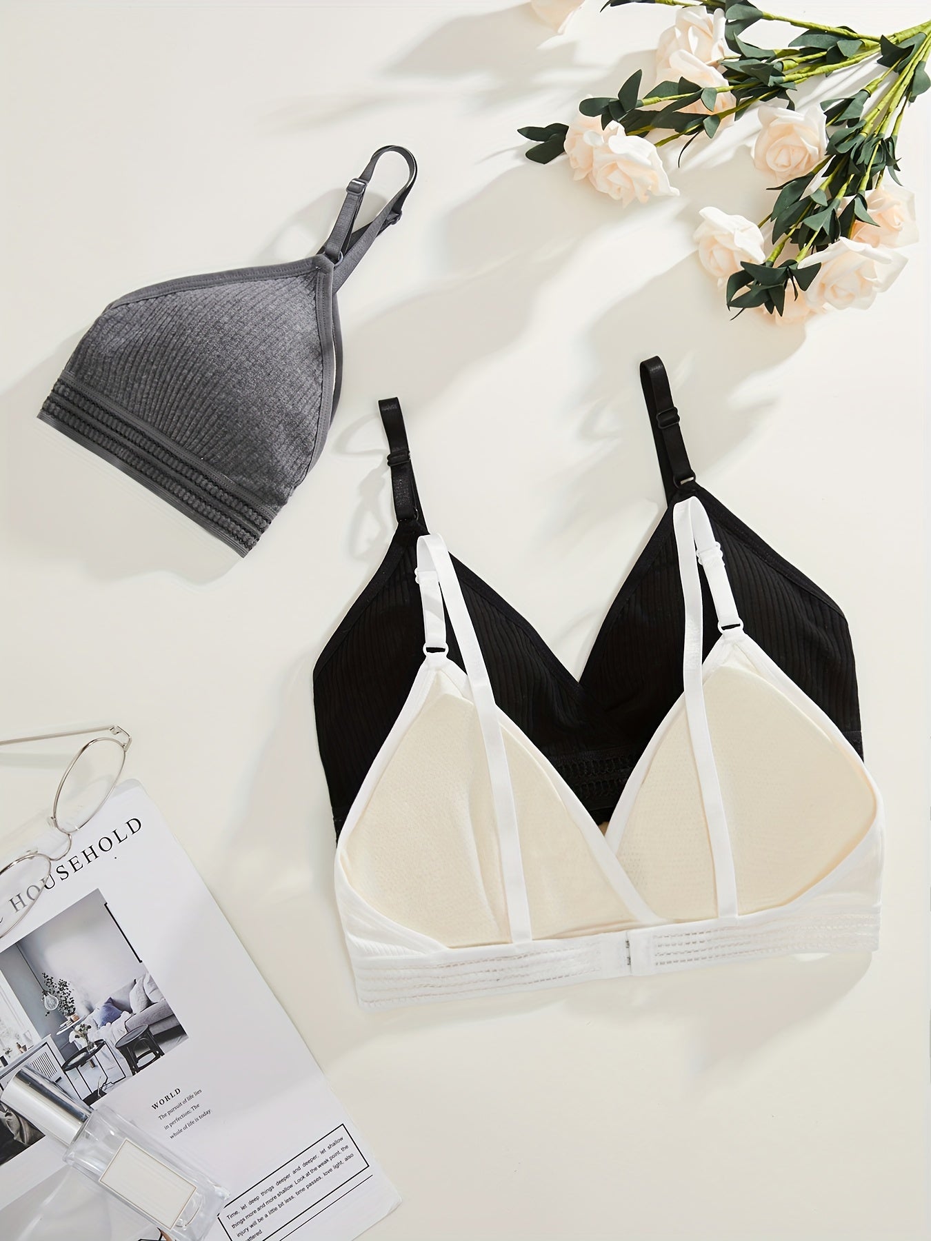 Soft, versatile bra set with removable pads and ribbed texture in black, white, and gray. Perfect for everyday comfort wear.