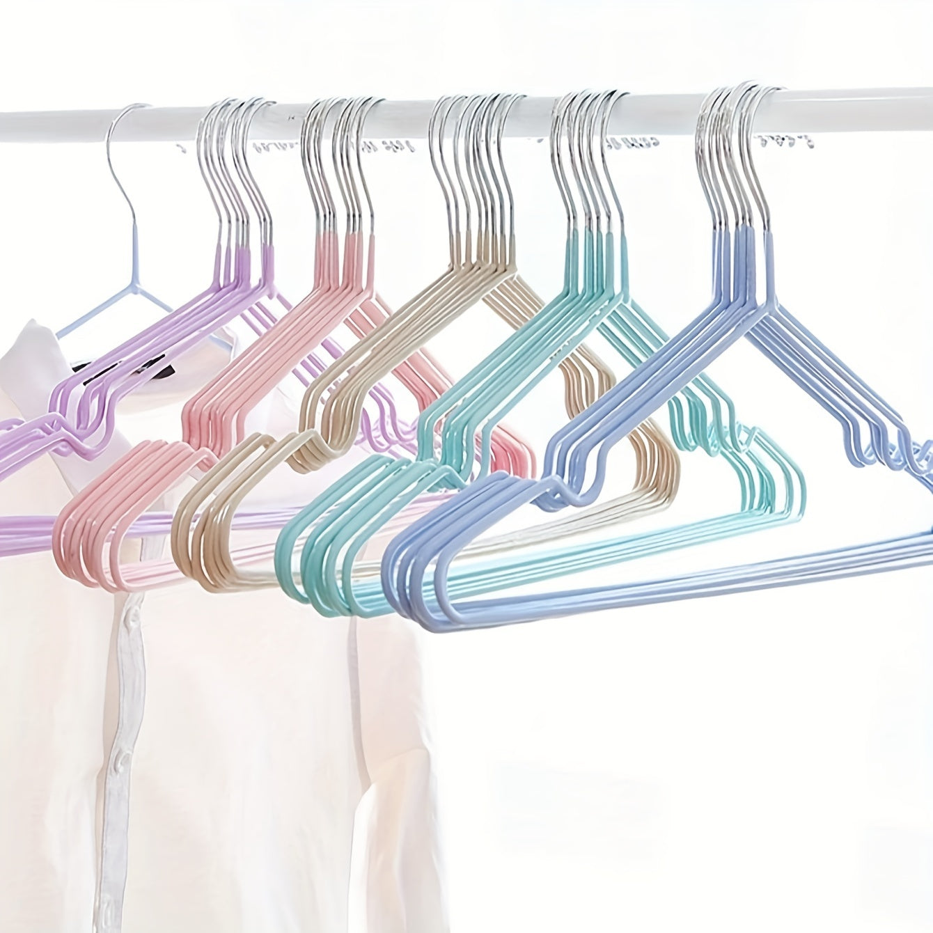 Essential for any home wardrobe, these durable non-slip metal hangers come in a convenient 10-pack. Featuring shoulder grooves to keep clothing in place, these space-saving hangers are perfect for hanging tops and dresses.