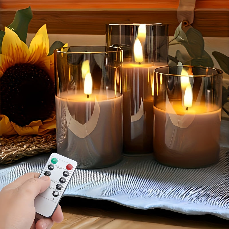 Three gray fireless LED candles with remote control and timer, battery-operated plastic column candles with realistic flashing effect, powered by non-rechargeable AA batteries, suitable for