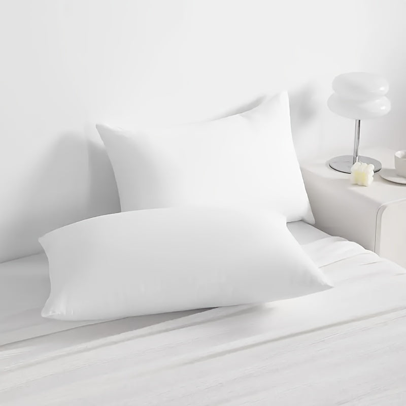 Get two sets of white pillowcases that are perfect for families, hotels, and apartments. These pillowcases provide a comfortable experience with their soft and breathable material. Made of high-quality fabric, they are suitable for bedroom, sofa, and