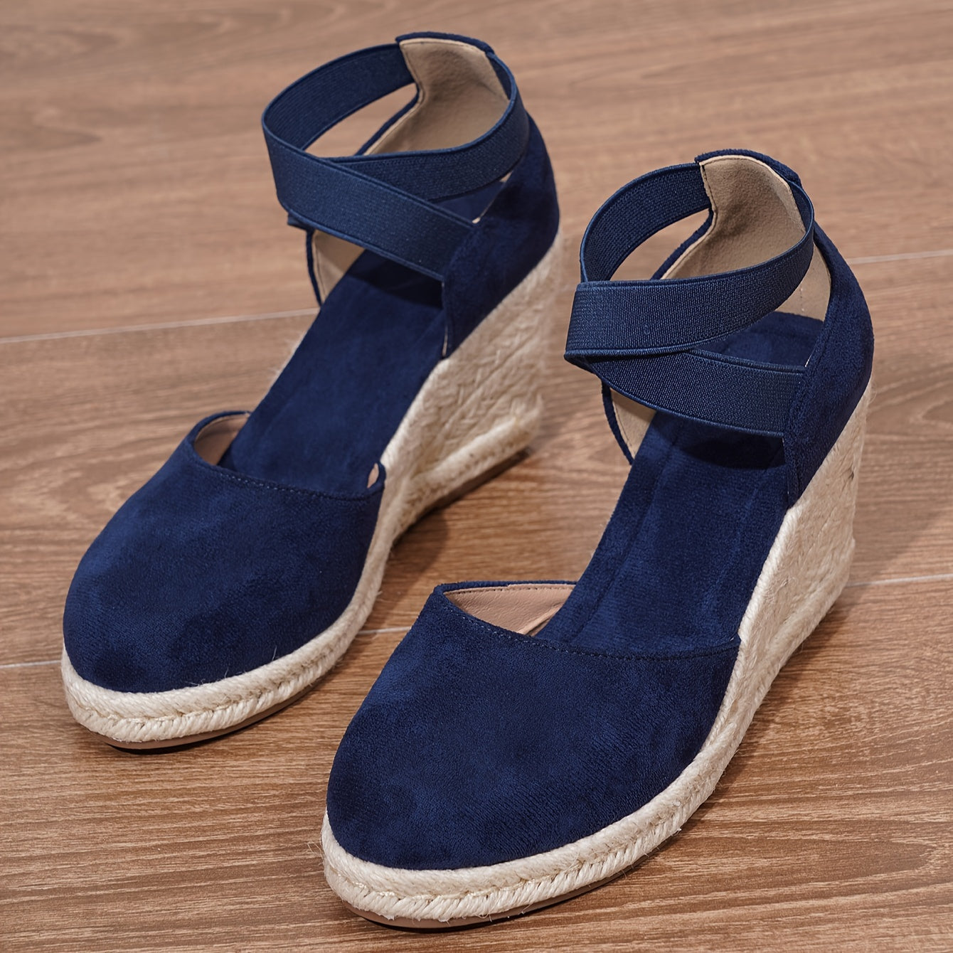 Women's slip-on wedge sandals with elastic cross straps, round toe, and non-slip sole.