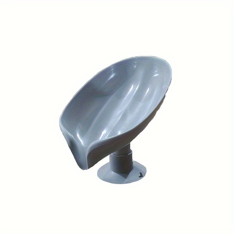 Suction cup soap dish with drainage for home organization and storage, suitable for kitchen and bathroom use.