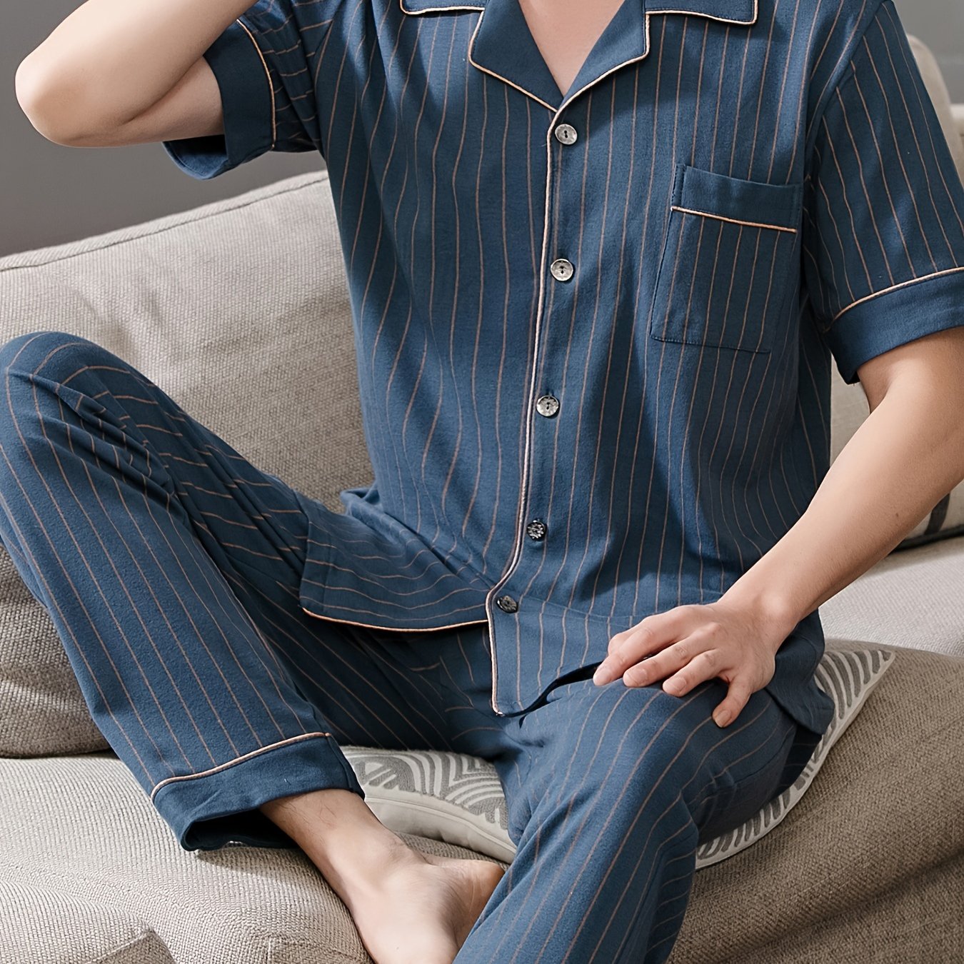 Men's navy blue stripe print pajama set with lapel collar, short sleeves, and trousers. Comfortable and skin-friendly cotton fabric for cozy loungewear.