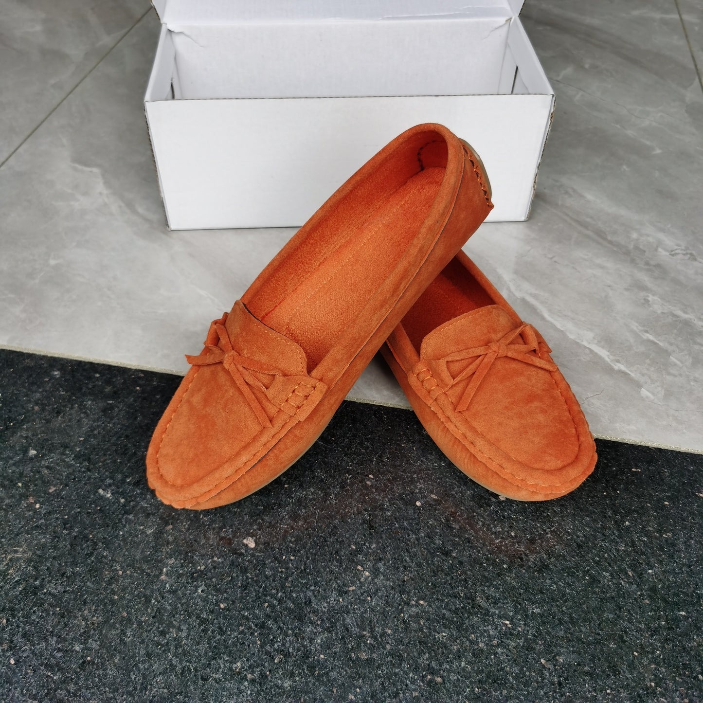 Retro flat loafers with bow detail, slip on style, and soft sole for casual wear.