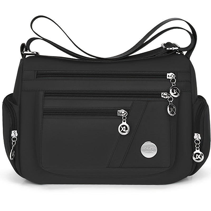 Stylish waterproof nylon crossbody bag with adjustable strap and multi-layer design, ideal for daily commute and travel.