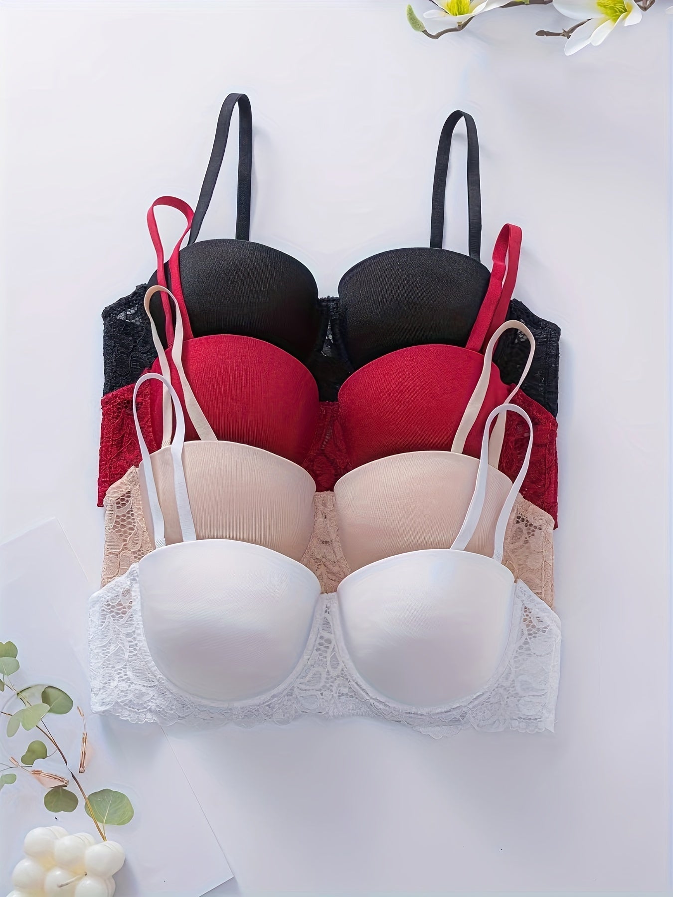 4pcs Women's Sexy Lace Push-Up Bras in Black, Red, Nude, and White. High support, non-padded, adjustable straps with floral lace detailing. Special occasion lingerie with nonremovable