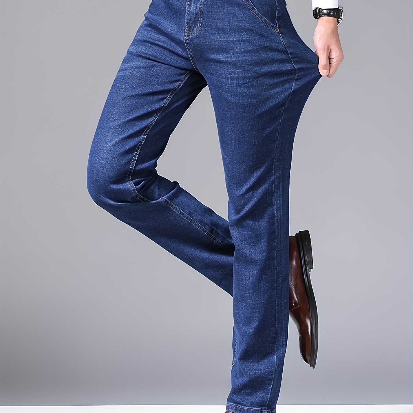 High-quality business casual denim pants for men, featuring a stretch comfort fit in a solid color washed finish. Made with all-season woven fabric of 65% cotton, 33.7% polyester, and 1.3%