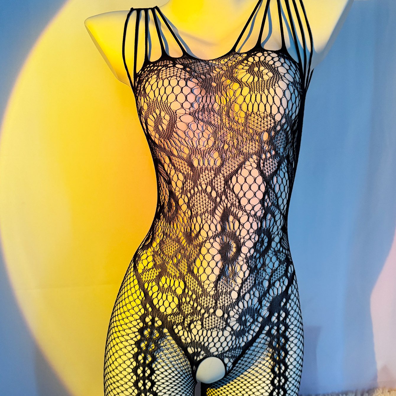 Seductive fishnet bodysuit with jacquard sleeves, crotchless design, and garter socks. Perfect Valentine's Day gift with high quality, comfortable, and stretchy fabric that fits just right.