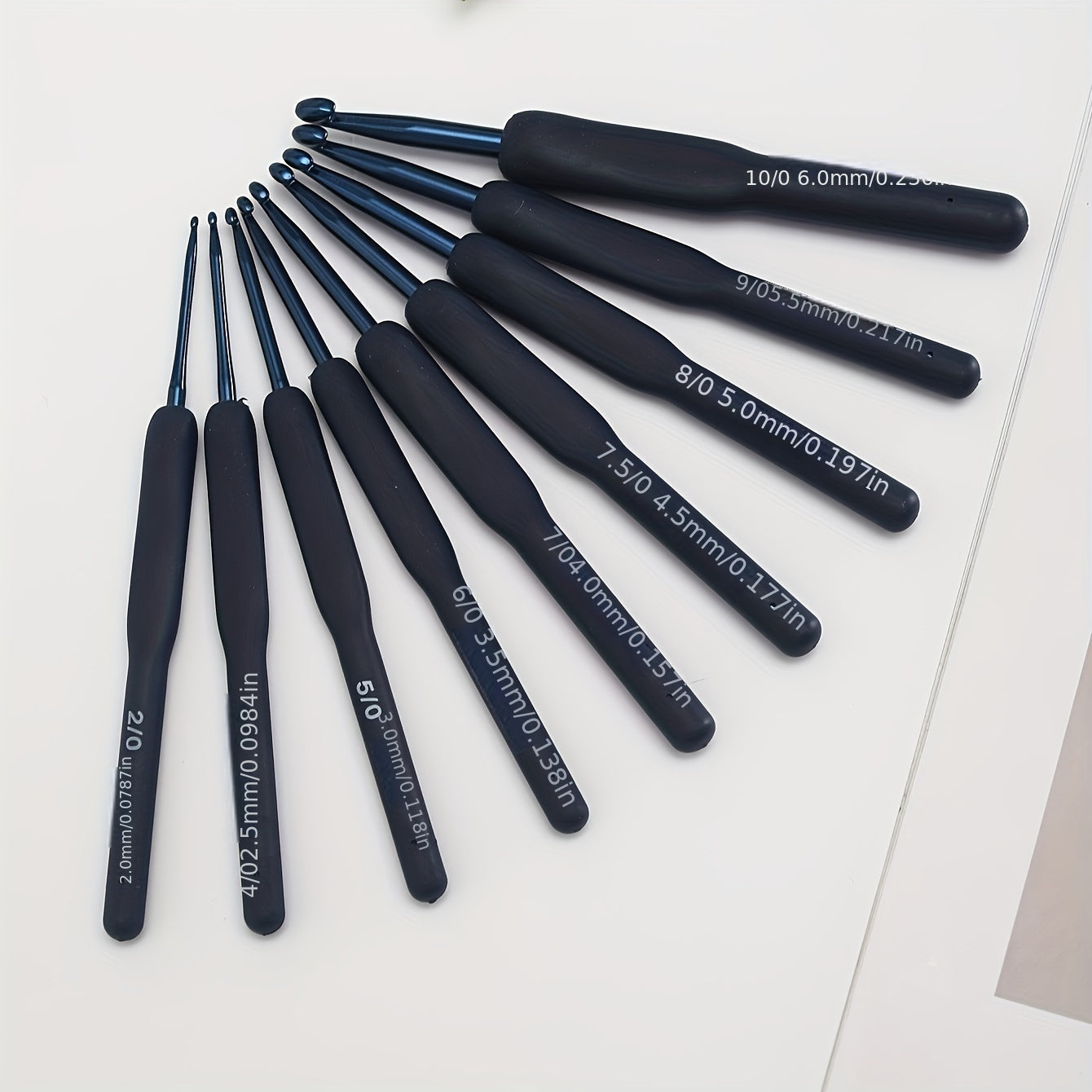 9-piece ComfortGrip Crochet Hooks Set with Ergonomic Dark Blue Needles, ideal for Arthritic Hands and Beginners.