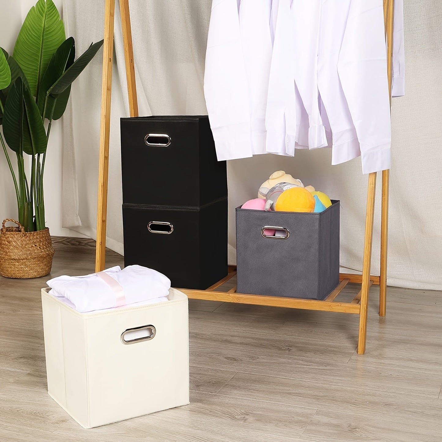 6 pieces of foldable fabric storage bins with handles are available in classic cube designs for organizing your home, bedroom, or office. Choose from black, blue, or cream options.