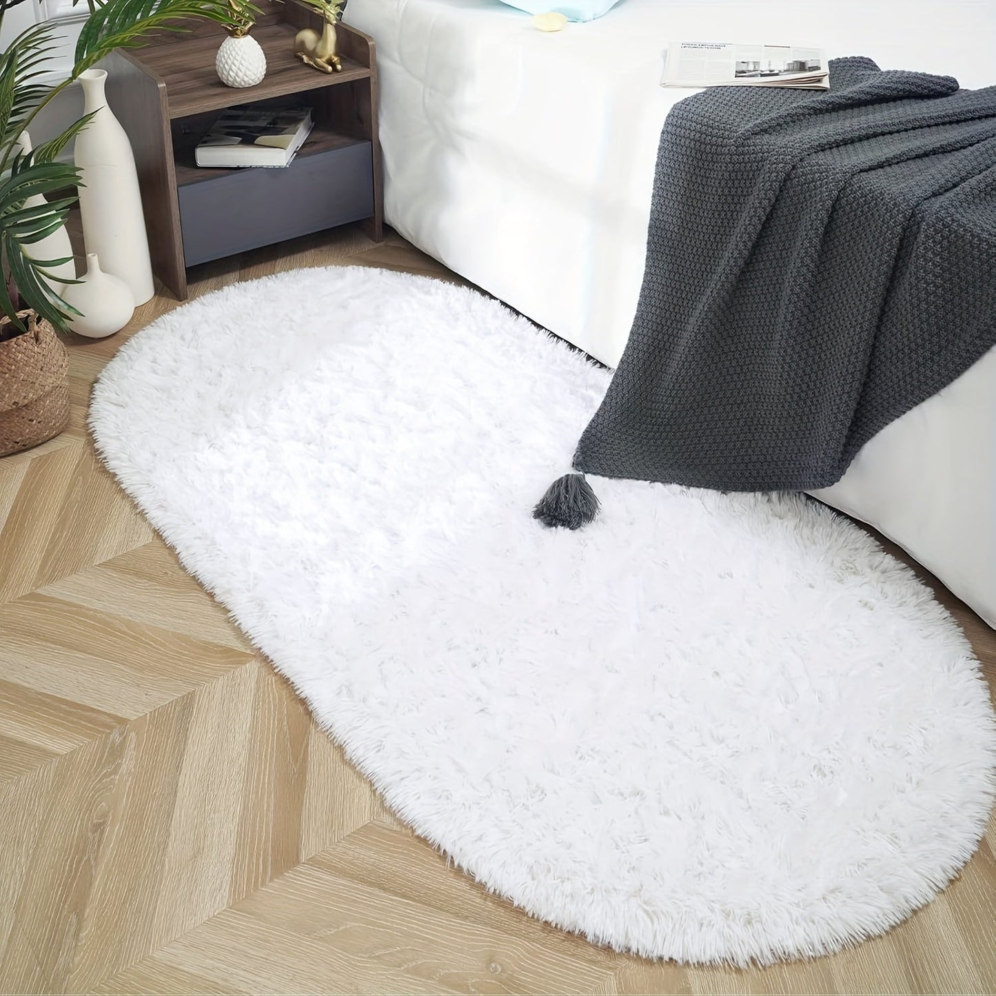 Soft and fluffy oval shaggy area rug, perfect for bedroom or living room. Made with skin-friendly thickened sponge and tufted polyester material. Durable and easy to maintain. Adds decorative touch to indoor spaces such as sofa, bedside, playroom, or