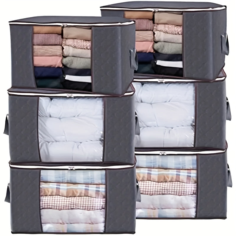 Three 90L storage bags with reinforced handles for organizing clothing, blankets, toys, and bedding in a bedroom wardrobe.