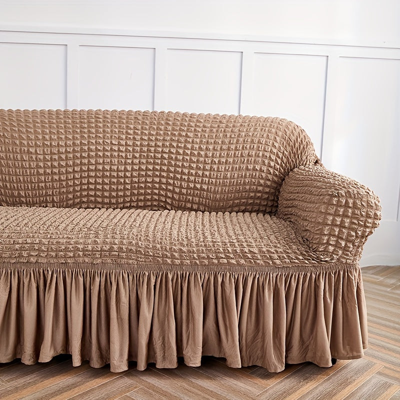 Seersucker skirt sofa cover protects couch from cat scratches in bedroom, office, or living room.