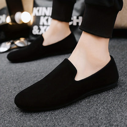 Men's black slip-on loafers with round toe and PVC sole for fashionably casual everyday wear in Spring/Summer 2024.