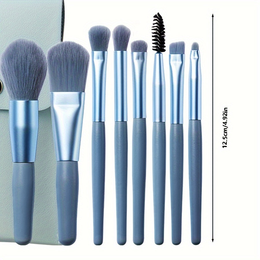 8 soft, portable facial makeup brushes in blue for entry-level beauty tools. Includes eyeshadow, nose shadow, blush, lip brush, eyelash comb, and travel powder brush. Ideal gift for beauty