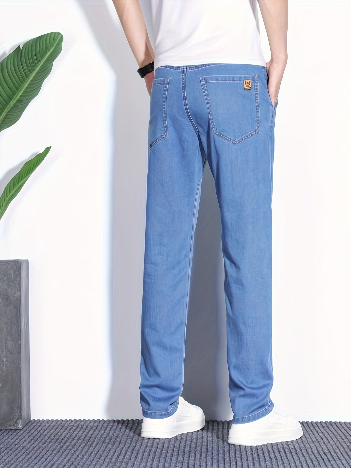 Summer jeans for men, regular fit with breathable lightweight denim and pockets.