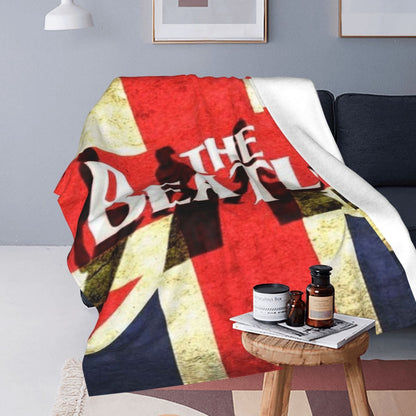 Stay warm and cozy with the ultra-soft Beatles Union Jack fleece throw blanket. Perfect for all seasons, this polyester blanket makes an ideal birthday or Christmas gift. With a contemporary style and knitted flannel in red, white, and blue, this blanket