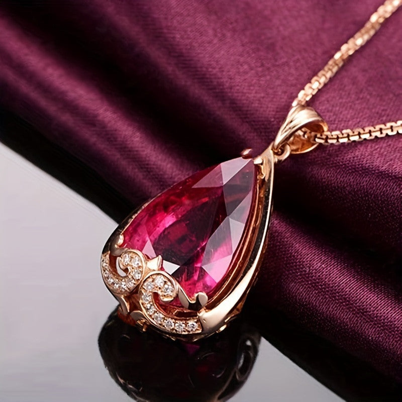 Elegant water drop-shaped pendant necklace coated in rose gold with simulated pigeon blood red and sapphire stones, exuding European and American flair for fashion-forward women.