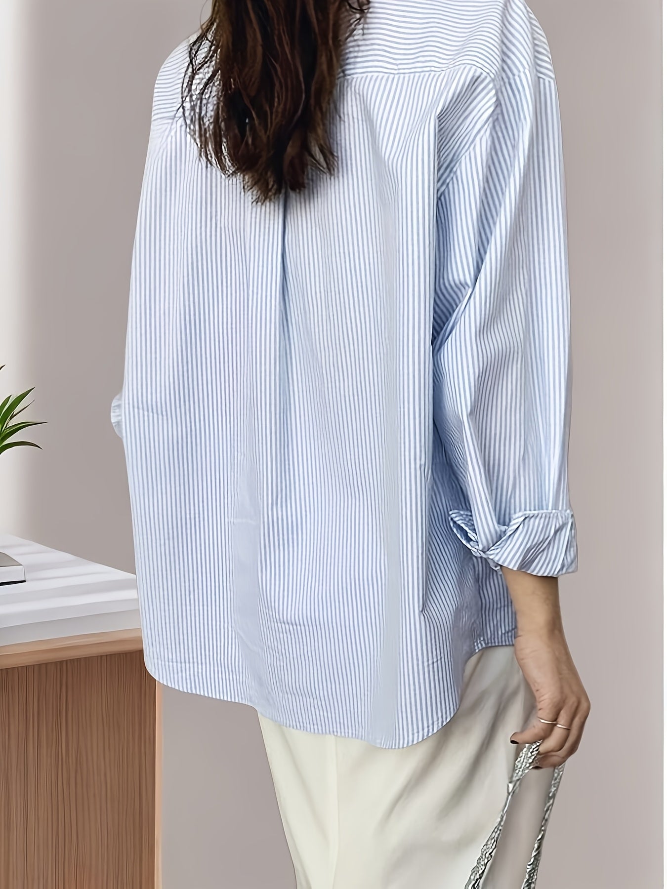 Striped print shirt with front buttons, polo collar, dropped shoulder long sleeves, pockets; versatile for spring and summer women's wear.